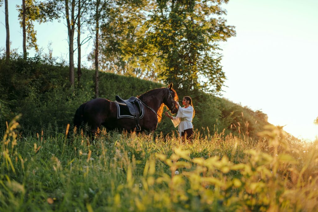 Woman Holding the Lead of a Horse